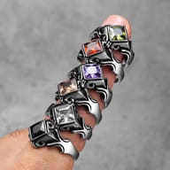 Side profile of the stainless steel ring, showcasing the flowing Gothic design on the band.