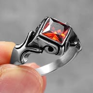Detailed view of the purple square-cut gemstone set within the striking Gothic ring band.