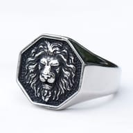 Side profile of the vintage-style stainless steel lion ring, showing the sturdy band.