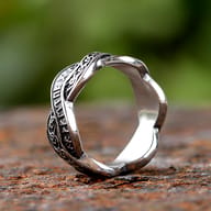 Side profile of the 316L stainless steel ring showing its polished inner surface and woven design.