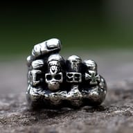 Side view of the skull fist ring, showcasing the robust 316L stainless steel band.