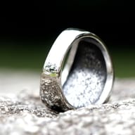 Top-down perspective highlighting the intricate details of the Mjolnir ring's face and surrounding wreath.