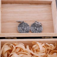 Male wearing one Tree of Life stainless steel earring, showcasing its size and style.