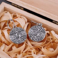 Close-up of a single 316L stainless steel Tree of Life earring, highlighting its intricate Yggdrasil etching.