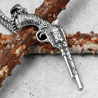 Intricate scrollwork detail on the 316L steel vintage revolver pendant
