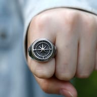 Angle shot of the 316L stainless steel ring, capturing both the compass rose and the anchor design, with focus on the ring's polished and antique finish.