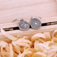 Close-up of the men's stainless steel dangle earring featuring a stylized mythic eagle head charm.
