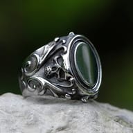 Angled view of the durable men's stainless steel ring, emphasizing its robust construction and gothic design elements.