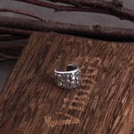 Top angle view of skull design 316L stainless steel ear cuffs.
