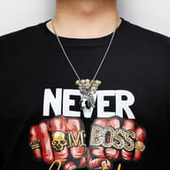 Full view of the Spartan helmet necklace against a neutral background