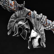 Angled shot of the Spartan helmet pendant with prominent texture details