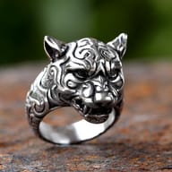 Side profile showcasing the tapered band and textured fur relief on the steel ring