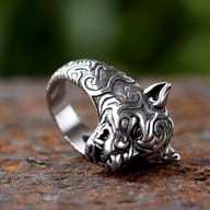 Detailed close up of the engraved tribal patterns and open jaw on the tiger ring