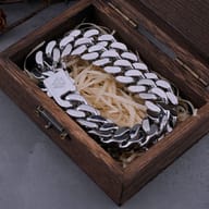 Heavy stainless steel Viking Valknut Cuban link chain coiled inside a wooden gift box