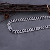 Overhead view of the solid interlocking curb links on the steel Viking necklace