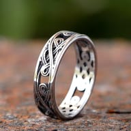 Close-up of openwork Celtic knot stainless steel ring.