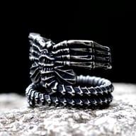 Close-up view of the detailed creature head design on the gothic stainless steel ring