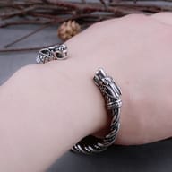 Top view of the twisted gold and silver tone stainless steel Norse cuff bracelet