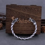 Viking dragon cuff bracelet worn on a man's wrist showing fit and scale
