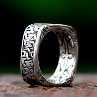 Close-up of a men's stainless steel square ring featuring intricate Viking Celtic knot patterns.