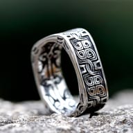 Detail view of the upper band of the square ring, highlighting the embossed Celtic knot design.
