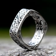 Side angle of the stainless steel square ring, showcasing its unique shape and smooth finish.