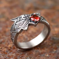 Side view of a 316L stainless steel dragon ring with intricate scale patterns