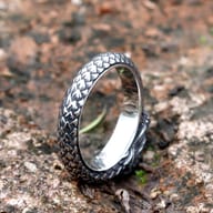 Mid-section view of the 316L stainless steel dragon ring's textured scales.