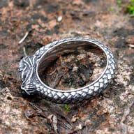 Close-up of the Nordic dragon ring's head and scaly textured band.