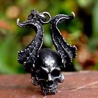 Close-up detail of textured horns and skull face on stainless steel pendant