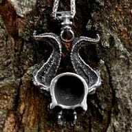 Side angle view of the detailed horned skull biker pendant
