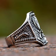 Close-up view of the polished Ali Zulfikar sword design on the durable 316L stainless steel ring, highlighting its vintage texture.