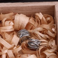 Angle view of no piercing stainless steel feather cuff earring