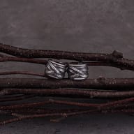 Feather motif stainless steel ear cuff worn on ear cartilage