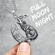 Viking Celtic Wolf Moon necklace held in hand, showcasing intricate details