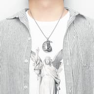 Wolf moon pendant next to a ruler for accurate size representation