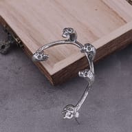Side profile showing the non piercing cartilage hook design of skull ear wrap
