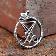 Angled shot highlighting the textured scales of the Ouroboros snake on the pendant.