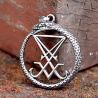 Close-up of the top section of the Ouroboros pendant, showing the snake's head and pendant bail.