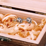 Side profile of the skull earring showing depth and butterfly clasp post