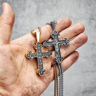 Close-up of the intricate bail and durable chain connecting to the Jesus cross pendant.