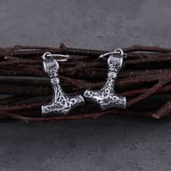 Stainless steel Viking hammer earrings displayed together on neutral background