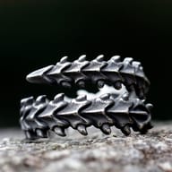 Detail view of the segmented vertebrae design on the men's gothic stainless steel ring.