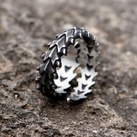 High-angle shot of the men's spine-inspired 316L stainless steel ring, highlighting its unique form.