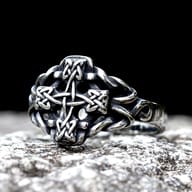 Celtic cross stainless steel ring worn on a hand showing size and fit