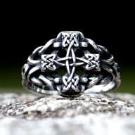 Top angle detailing the oxidized finish and raised cross knotwork pattern