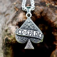 Detailed view of 'ACE OF SPADES' engraved on the gothic-style pendant
