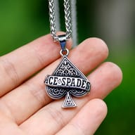 Robust 60cm stainless steel chain and Ace of Spades necklace on dark rock