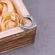 Nordic geometric stainless steel hoop earring worn on a man's ear