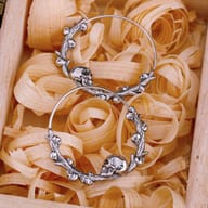 Front view of the circular gothic skull hoop earring with wire closure